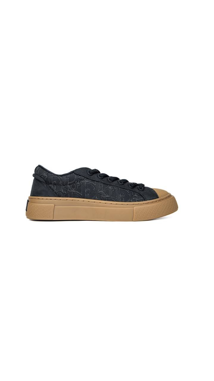 Dior B33 sneaker in black fabric with a gum sole.