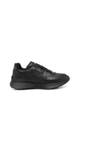 Alexander McQueen Sprint Runner sneaker in black leather.